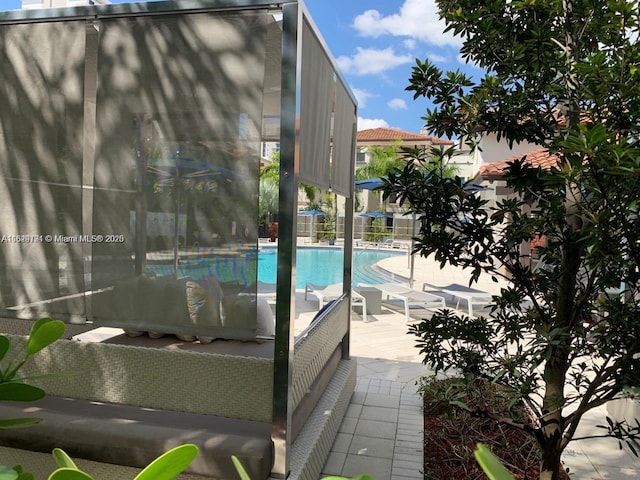 pool with a patio