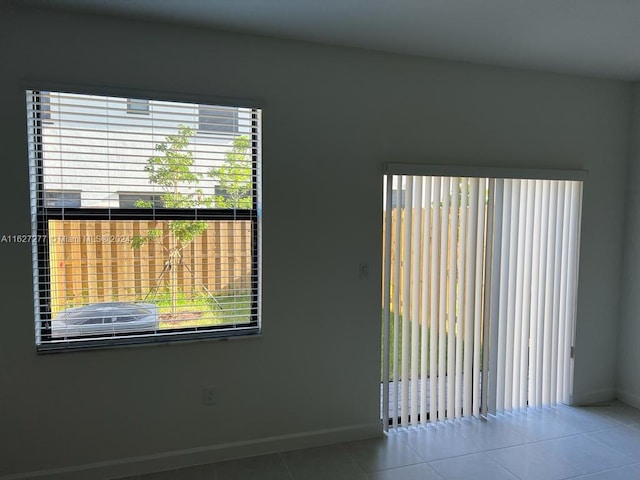 spare room with tile patterned floors