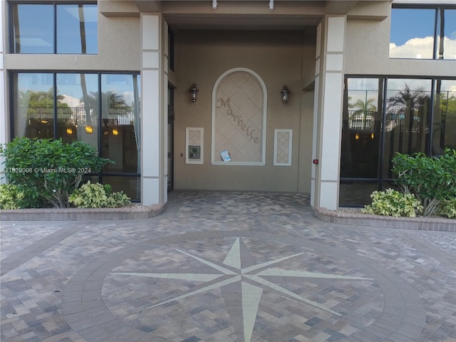 property entrance featuring a patio