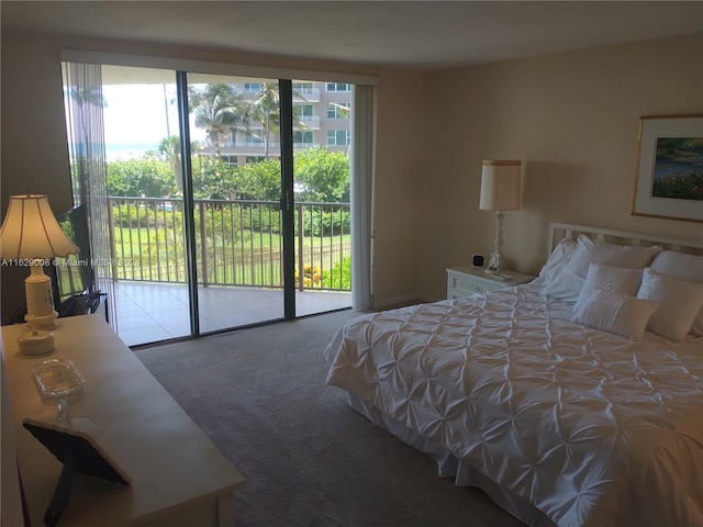 carpeted bedroom with access to outside