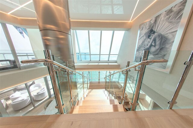 stairway featuring hardwood / wood-style flooring