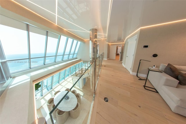 17121 Collins Ave Unit Ph4803, Sunny Isles Beach, FL 33160 - corridor featuring light wood-style floors, baseboards, and a high ceiling