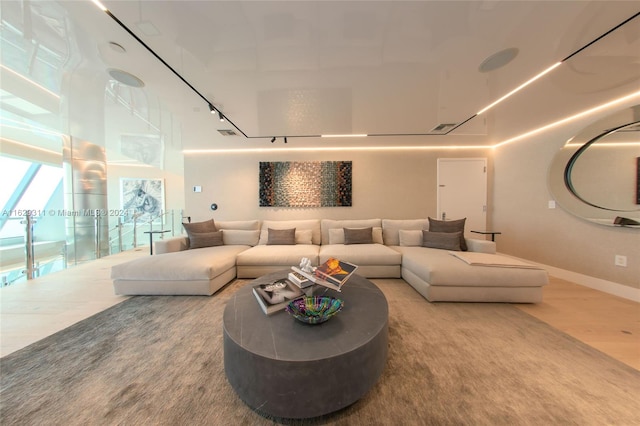 living room featuring hardwood / wood-style floors and rail lighting