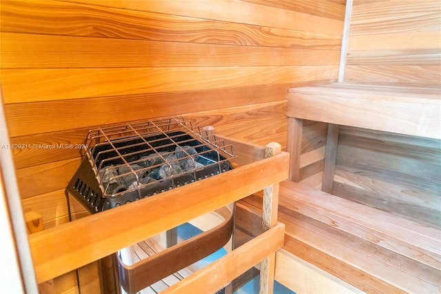 view of sauna with wood walls