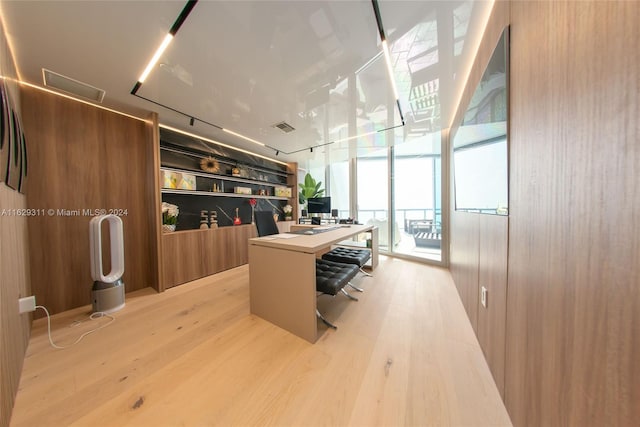 office space featuring light wood-type flooring and expansive windows