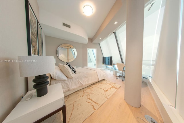 17121 Collins Ave Unit Ph4803, Sunny Isles Beach, FL 33160 - bedroom featuring vaulted ceiling and wood finished floors