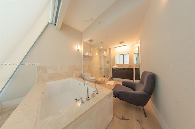 full bathroom with vanity, plus walk in shower, hardwood / wood-style floors, and toilet