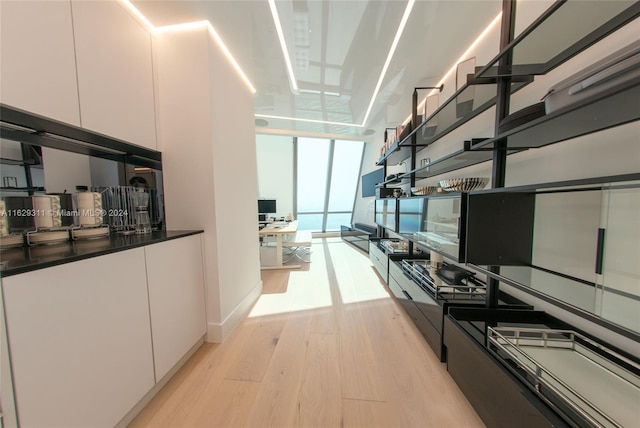 kitchen featuring white cabinets and light hardwood / wood-style floors