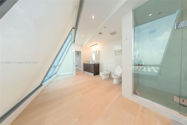 bathroom featuring vanity, a bidet, a shower with shower door, hardwood / wood-style flooring, and toilet