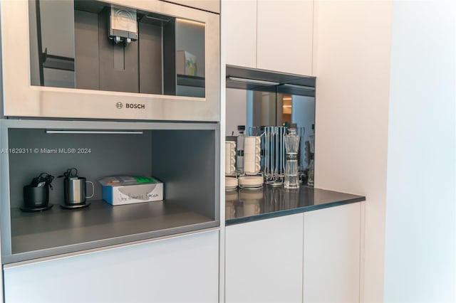 interior space featuring white cabinets