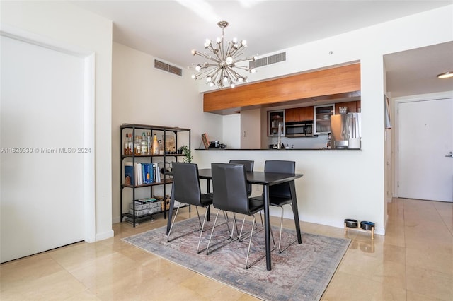 dining space featuring an inviting chandelier