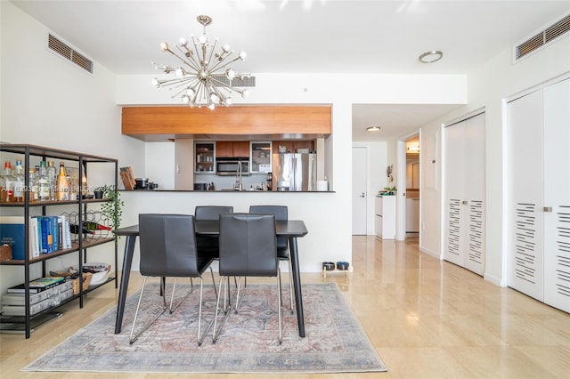 dining room featuring an inviting chandelier