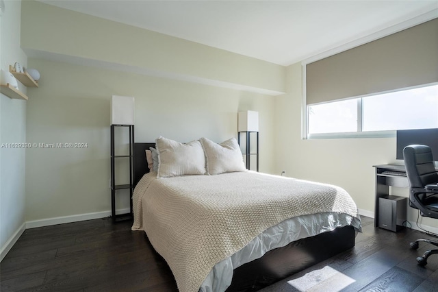 bedroom featuring dark wood-type flooring