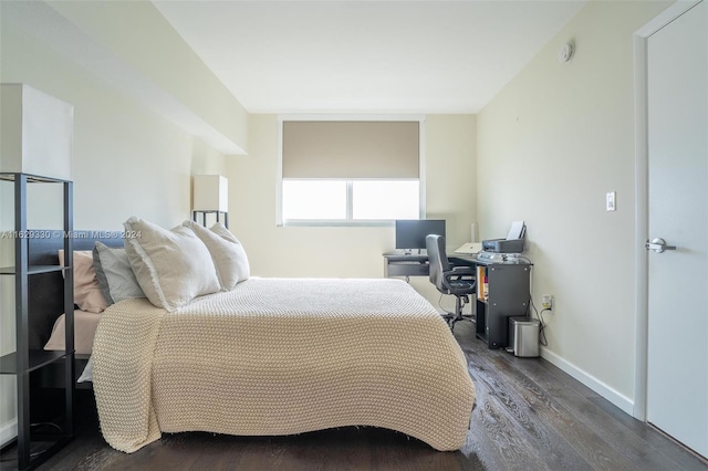 bedroom featuring dark hardwood / wood-style flooring