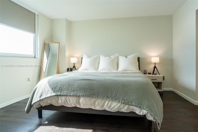 bedroom featuring dark hardwood / wood-style floors