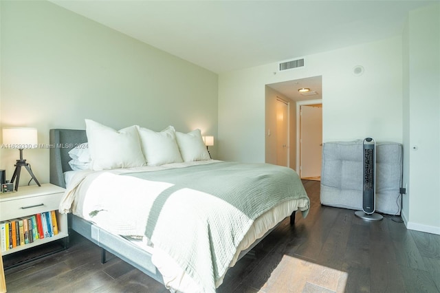 bedroom featuring dark hardwood / wood-style floors