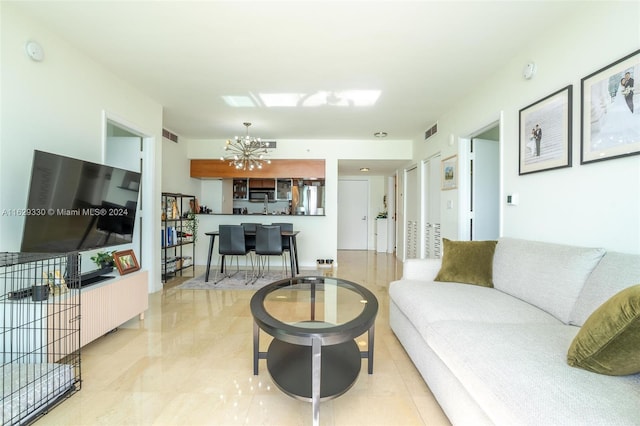 living room featuring a notable chandelier