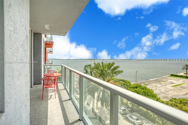 balcony featuring a water view