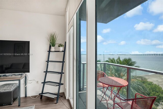 balcony featuring a water view