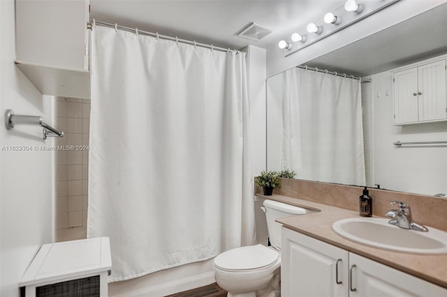 bathroom featuring vanity, shower / bath combination with curtain, toilet, and visible vents