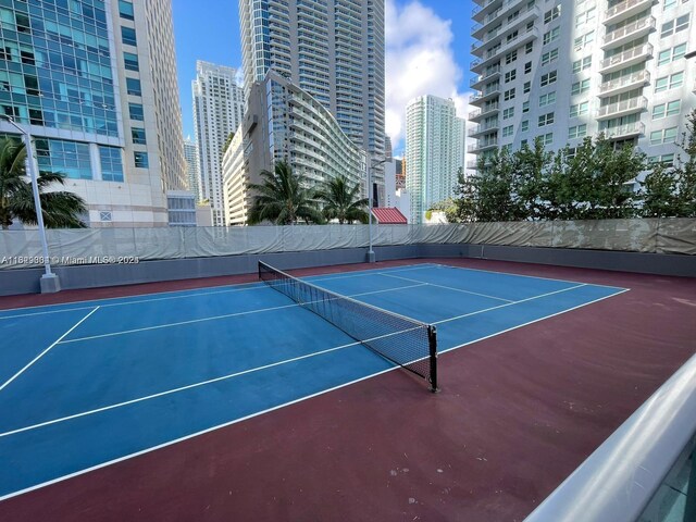 view of sport court with basketball hoop