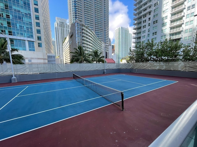 view of sport court featuring a city view and community basketball court