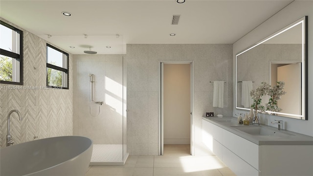 bathroom featuring tile walls, vanity, tile patterned flooring, and independent shower and bath