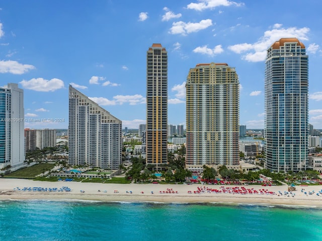 property's view of city with a water view and a view of the beach