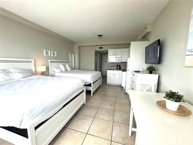 bedroom with light tile patterned floors