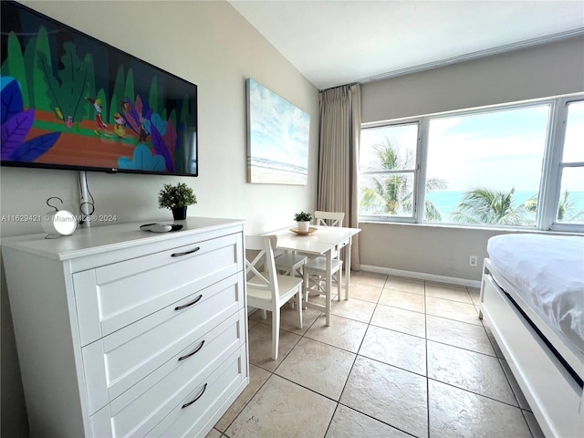 bedroom featuring light tile patterned flooring