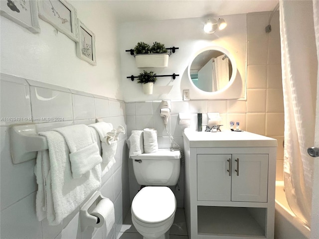 full bathroom featuring toilet, vanity, tile walls, shower / tub combo, and decorative backsplash