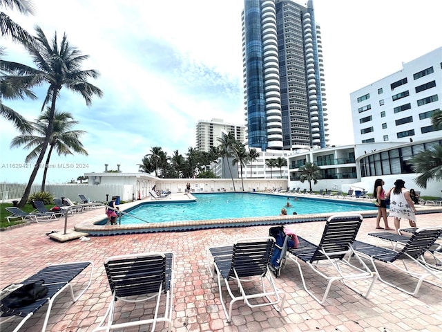 view of swimming pool with a patio