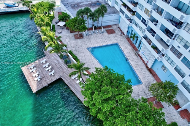 view of swimming pool with a water view