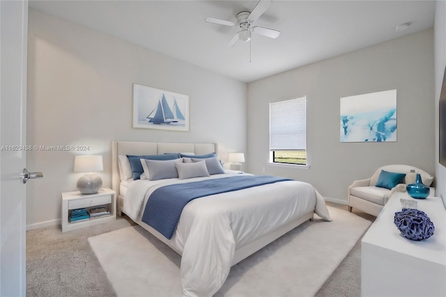 bedroom with light colored carpet and ceiling fan