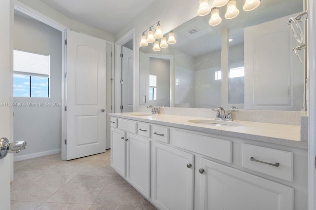 bathroom featuring dual vanity and tile patterned floors