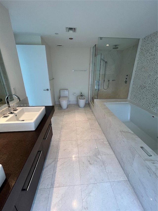 full bathroom featuring tile patterned flooring, separate shower and tub, toilet, and vanity