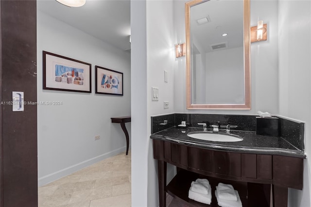 bathroom with vanity and tile patterned flooring