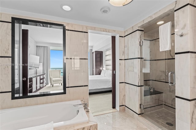 bathroom with separate shower and tub