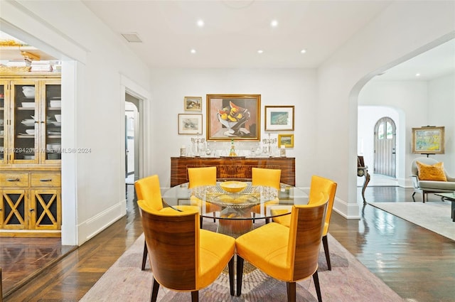 dining room with dark wood-type flooring