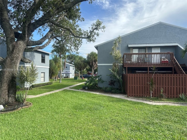 view of yard with a wooden deck