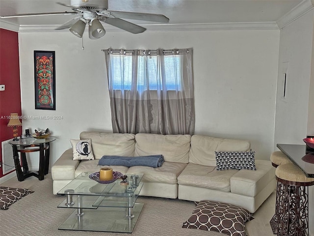 living room with ornamental molding, carpet, and ceiling fan