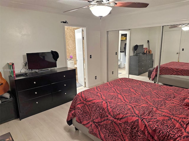 bedroom featuring crown molding, connected bathroom, ceiling fan, light hardwood / wood-style floors, and a closet