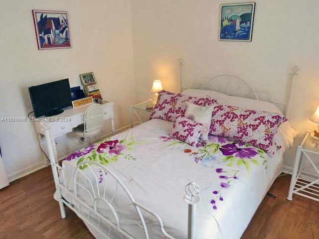 bedroom featuring hardwood / wood-style floors