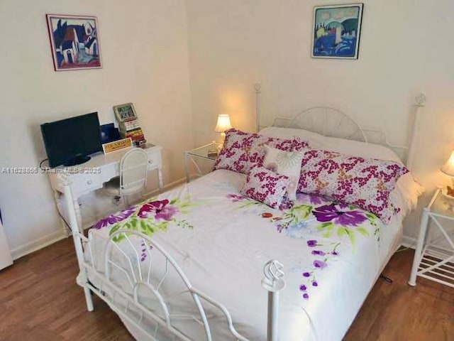 22 Crossings Cir Unit E, Boynton Beach, FL 33435 - bedroom featuring wood finished floors and baseboards