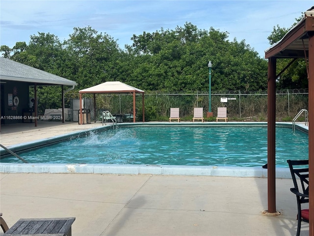 view of pool featuring a patio and a gazebo