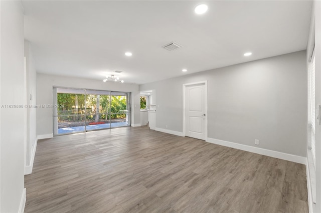 spare room featuring light wood-type flooring