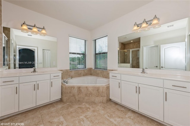 bathroom with vanity and independent shower and bath