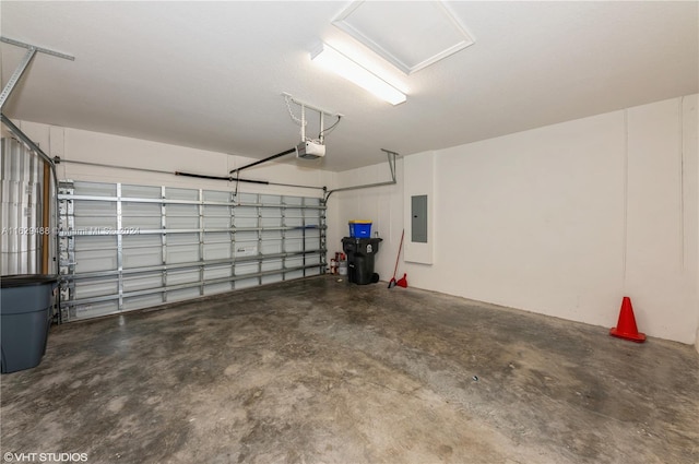 garage with a garage door opener and electric panel