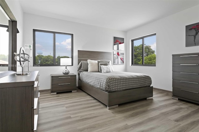 bedroom with light hardwood / wood-style flooring