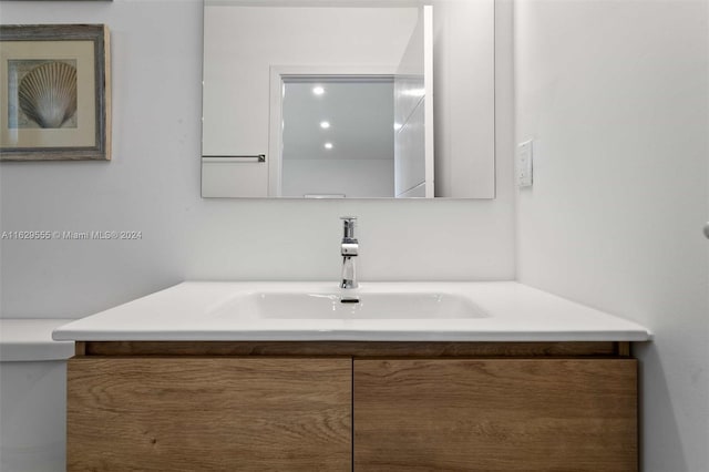 bathroom with vanity and toilet